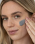 Woman using Balance Charcoal Moisturizer
