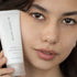 Woman holding the Potent C Superfood Masque 50ML