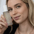 Woman with Green Envee Hydrate Facial Mist