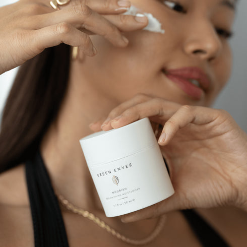 person holding NOURISH REPLENISHING MOISTURIZER 50ML